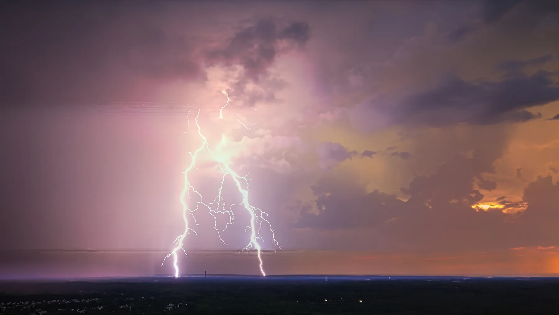 Afterglow lightning, pink and violet at dusk